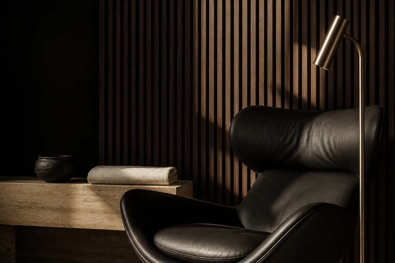 Material study with a black leather chair and dark timber